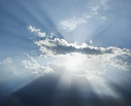 clouds with sun rays shining through image